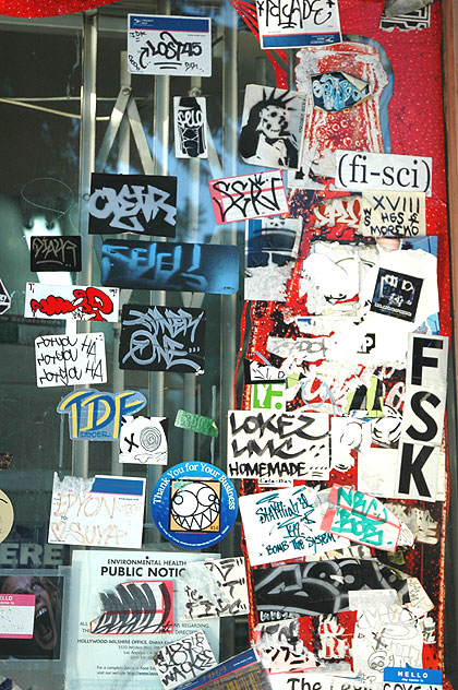 Stickers on a window on Hollywood Boulevard