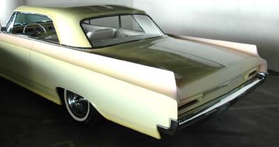 A 1964 Oldsmobile Dynamic 88 with restrained fins but a wonderful pearl paint job...