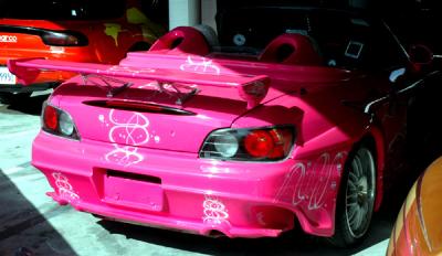 A pink Pocket Rocket, the sort of car they call a Rice Rocket out here, for obvious reasons...