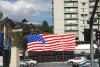 Nearby, our Flag, ratty apartments, and the Japanese temple-restaurant on the hill -