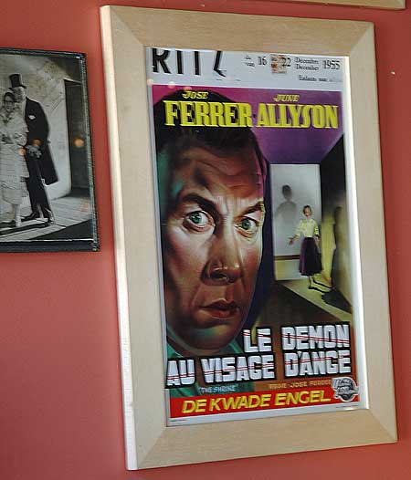 A poster for a Universal picture, dubbed in French, showing at the German theater, antique store wall, Hollywoodland, Beachwood Drive, Los Angeles