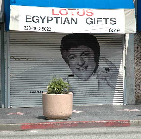 Liberace on Hollywood Boulevard security door of a store selling Egyptian Gifts