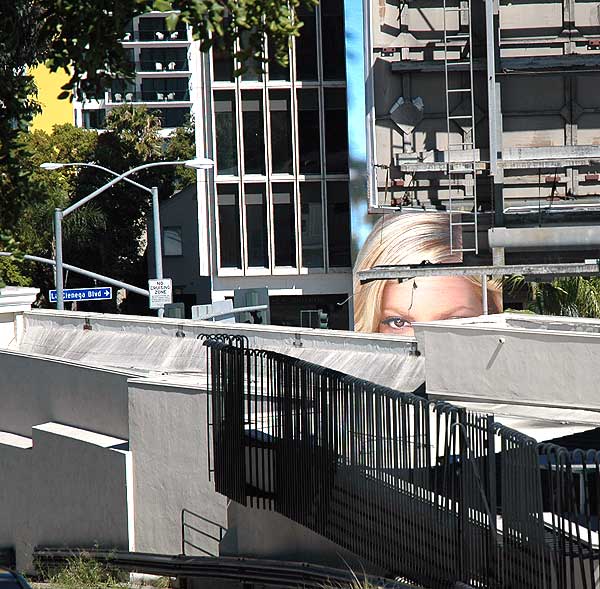 This caged eye is looking at you - Sunset Boulevard at La Cienega, looking east, the balconies of the Mondrian Hotel in the background, Thursday, April 13, 2006