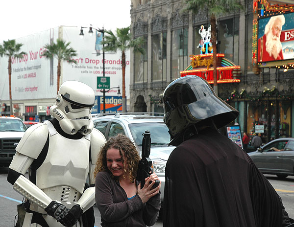 Imperial Storm Trooper and Darth Vadar on Hollywood Boulevard hitting on pretty girl