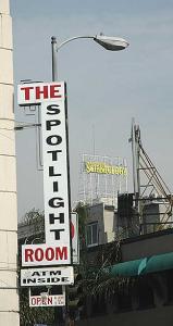 Scientology looms over a strip joint -