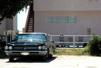 MALIBU - an old car in a quiet courtyard