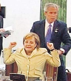 Bush massages German Chancellor Angela Merkel's shoulders -