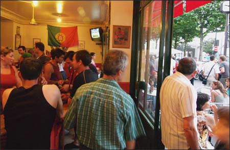Caf? au Ch?teau, Paris 14th - the local Portuguese watch France defeat Portugal to advance to the World Cup championship game