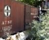 Who lives here, across this bridge made from an old boxcar?  